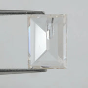 Emerald cut lab grown diamond with step facets, high clarity, transparent stone with visible internal inclusion, ethical IGI certified loose diamond for jewelry setting