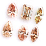 Fancy color lab grown diamond mix shape CVD loose diamonds including pear oval marquise emerald cut champagne and peach diamonds for engagement ring and custom fine jewelry making.