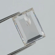Emerald cut lab grown diamond with step facets, high clarity, transparent stone with visible internal inclusion, ethical IGI certified loose diamond for jewelry setting
