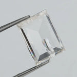 Emerald cut lab grown diamond with step facets, high clarity, transparent stone with visible internal inclusion, ethical IGI certified loose diamond for jewelry setting