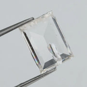 Emerald cut lab grown diamond with step facets, high clarity, transparent stone with visible internal inclusion, ethical IGI certified loose diamond for jewelry setting