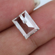 Emerald cut lab grown diamond with step facets, high clarity, transparent stone with visible internal inclusion, ethical IGI certified loose diamond for jewelry setting