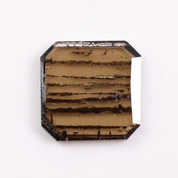 0.88 Ct brown Emerald cut lab grown diamond loose stone with geometric shape and rich brown color sparkle.