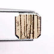 0.88 Ct brown Emerald cut lab grown diamond loose stone with geometric shape and rich brown color sparkle.
