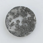 Round cut lab grown salt and pepper diamond featuring bold black dendritic inclusions in a transparent stone, faceted for brilliance and showcasing a unique natural pattern