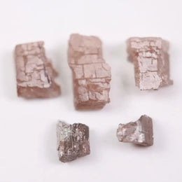 what does a diamond look like before it is cut, what does a diamond look like in the rough, black faceted diamond