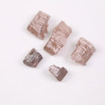 what does a diamond look like before it is cut, what does a diamond look like in the rough, black faceted diamond
