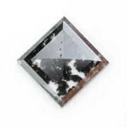 Square cut lab grown diamond with step facets, high clarity, mirror-like reflections, and visible inclusions on a neutral background