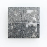 Square cut lab grown diamond with step facets, high clarity, mirror-like reflections, and visible inclusions on a neutral background