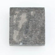 Rectangular step cut salt and pepper lab grown diamond with black galaxy inclusions and scattered white speckles, unique ethical diamond for custom jewelry design