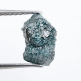 loose raw diamonds displaying natural rough surfaces for custom jewelry and gemstone projects.