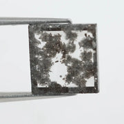 Geometric step cut lab grown salt and pepper diamond with black moss-like inclusions, clear edges and modern faceting, unique ethical loose diamond for alternative engagement ring