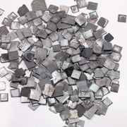 Fancy grey black lab grown rough diamond lot with square slice Carré cut tiles, raw CVD diamonds for custom jewelry making and unique engagement ring designs.