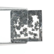 Close-up of a lab-grown diamond featuring unique black inclusions, showcasing exceptional clarity and brilliance, perfect for an elegant jewelry piece.