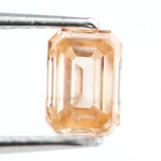 0.53 Ct fancy brown emerald cut lab grown diamond with elegant step cut facets, premium loose diamond for custom jewelry designs.