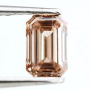 0.60 Ct brown emerald cut lab grown diamond with elegant step cut facets and rich earthy tone, loose fancy diamond for custom jewelry design. 