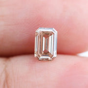 0.60 Ct brown emerald cut lab grown diamond with elegant step cut facets and rich earthy tone, loose fancy diamond for custom jewelry design. 