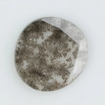 Round lab-grown diamond with unique gray inclusions, faceted for maximum sparkle, ethically created, ideal for custom rings and jewelry