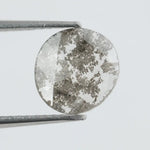 Round lab-grown diamond with unique gray inclusions, faceted for maximum sparkle, ethically created, ideal for custom rings and jewelry