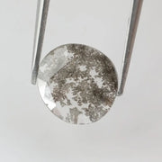 Round lab-grown diamond with unique gray inclusions, faceted for maximum sparkle, ethically created, ideal for custom rings and jewelry