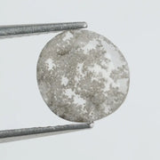 Round lab-grown diamond with unique gray inclusions, faceted for maximum sparkle, ethically created, ideal for custom rings and jewelry