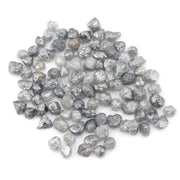 grey black natural diamond with a rugged raw surface and uncut profile