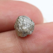 grey colour rough of a raw diamond and pure diamonds collection