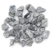 black raw diamond with a natural uncut rough surface for jewelry design projects