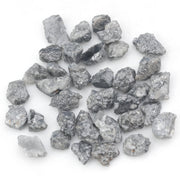 black raw diamond with a natural uncut rough surface for jewelry design projects