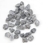 black raw diamond with a natural uncut rough surface for jewelry design projects