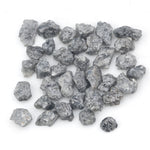 black raw diamond with a natural uncut rough surface for jewelry design projects