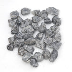 black raw diamond with a natural uncut rough surface for jewelry design projects