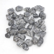 black raw diamond with a natural uncut rough surface for jewelry design projects