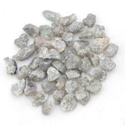light grey raw diamond with an uncut rough profile for jewelry creation