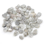 light grey raw diamond with an uncut rough profile for jewelry creation