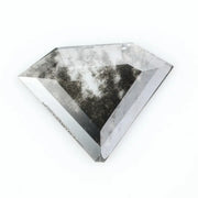 Faceted lab-grown black and white diamond with unique marbled inclusions, perfect for rings, pendants, and ethical jewelry designs.
