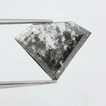 Faceted lab-grown black and white diamond with unique marbled inclusions, perfect for rings, pendants, and ethical jewelry designs.