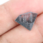 Faceted lab-grown black and white diamond with unique marbled inclusions, perfect for rings, pendants, and ethical jewelry designs.