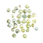 Natural green diamond with rare earthy green color, loose gemstone displaying brilliance and unique natural crystal characteristics.