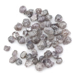 fancy pink raw diamond showing a natural rough surface for gold jewelry design