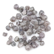 fancy pink raw diamond showing a natural rough surface for gold jewelry design