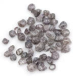 fancy pink raw diamond showing a natural rough surface for gold jewelry design