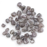 fancy pink raw diamond showing a natural rough surface for gold jewelry design