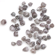 fancy pink raw diamond showing a natural rough surface for gold jewelry design