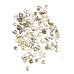 Natural multi colour rough diamonds with yellow, grey, champagne and white tones displayed on white background.