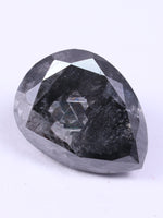 Faceted black stone on a white background