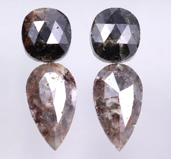 Pair of earrings with faceted stones on a white background