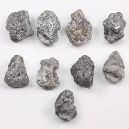 Close-up view of a sparkling gray diamond in a white gold setting.