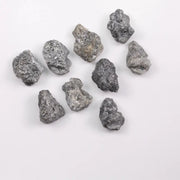 Close-up view of a sparkling gray diamond in a white gold setting.