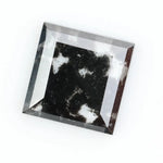 Premium lab-grown diamond with radiant square cut and distinctive black inclusions, offering a unique and sustainable choice for fine jewelry.